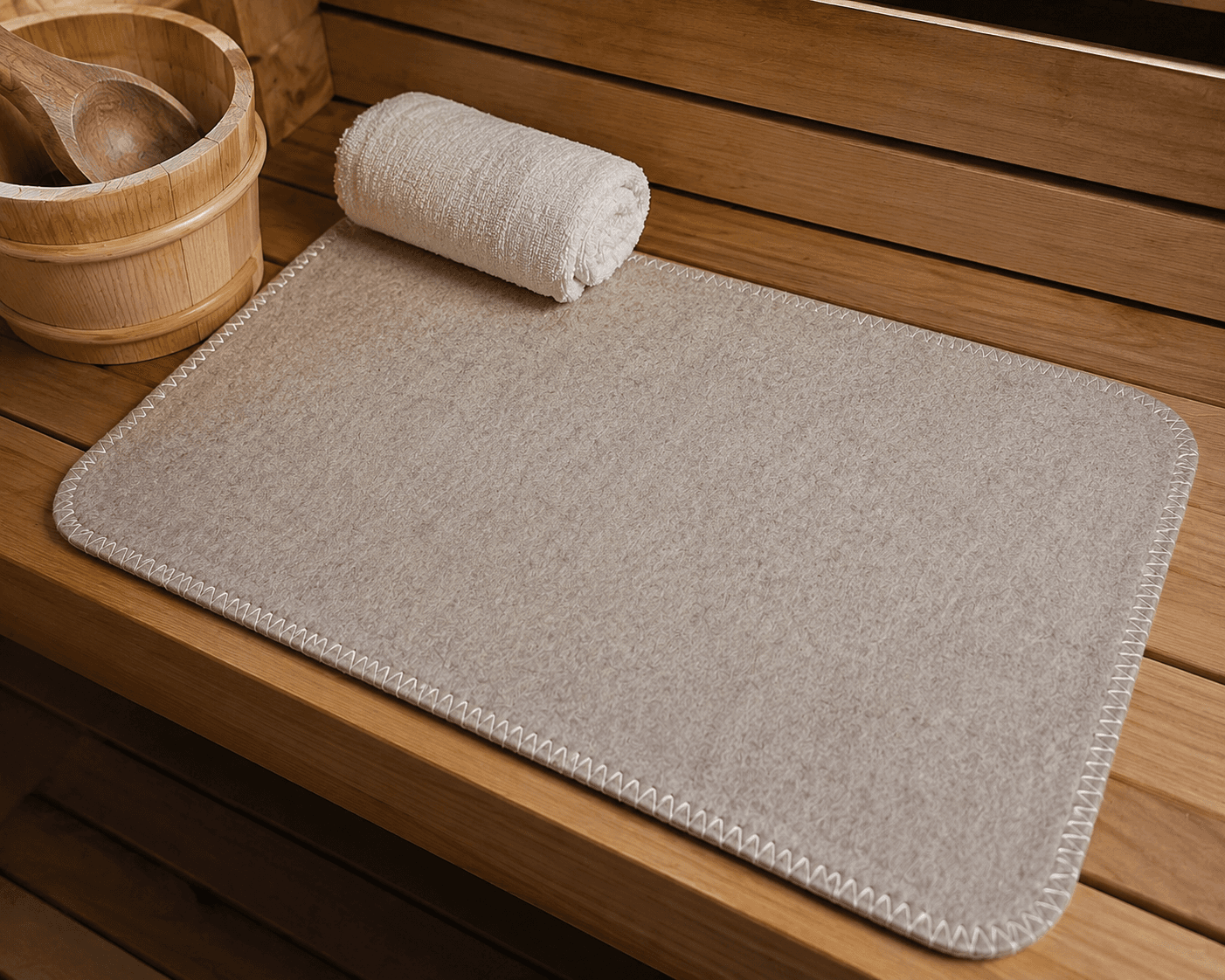 Premium wool sauna mat on a cedar sauna bench